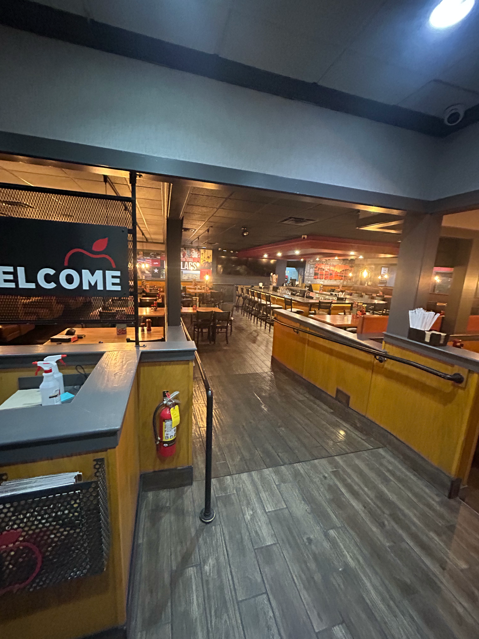 Gray wood-look plank flooring through a restaurant dining area